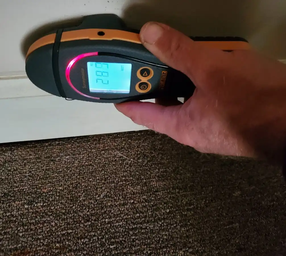 Moisture detection at baseboard during Storm Damage Restoration in Claremore